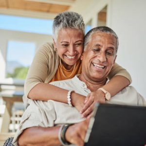 Tablet, retirement and senior couple on outdoor patio reading website for online quote, wealth and asset management research. Elderly, senior people happy with digital app life insurance information